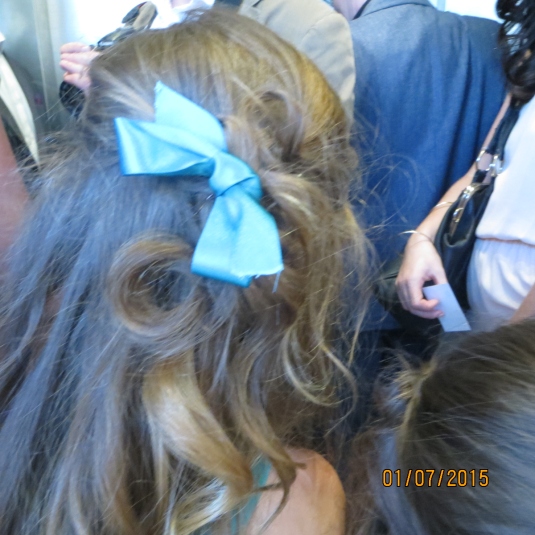 Turquoise ribbons in her hair
